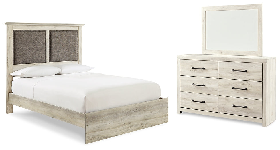 Cambeck King Upholstered Panel Bed with Mirrored Dresser